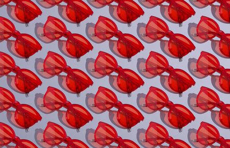 Red sunglasses pattern on gray backgroundの写真素材