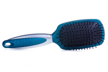 Blue hair brush on white background isolationの写真素材