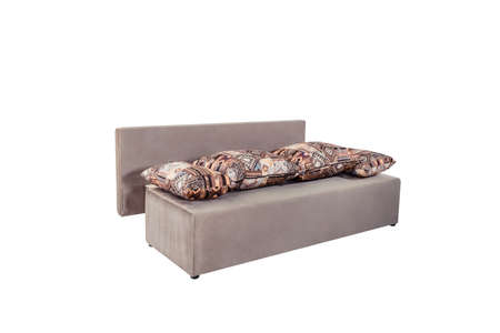 Beige brown soft sofa with large pillows, folding functionの写真素材