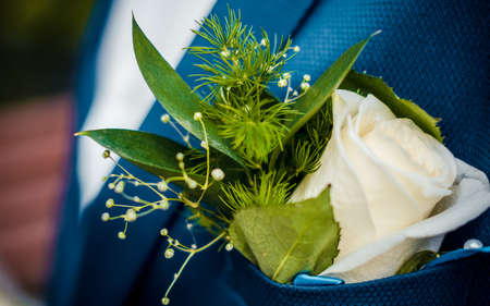 Fresh green boutonniere, blue jacketの写真素材