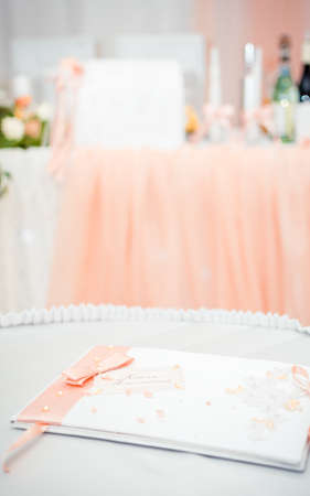 The inscription "Book of wishes", wedding decoration in the hall, a folder with documents and a bowの写真素材