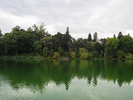 Autumn evening nature and green colored pond in High Park, Toronto, Canadaの写真素材