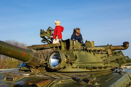 Two serious boys climbed the armor of a military tank, Kiev, Ukraineの写真素材