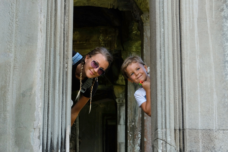 Happy smiling mother and son together visiting Angkor, Cambodiaの写真素材