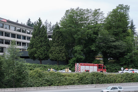 Burnaby, Canada - July 18, 2018: Road accident. Fire truck police and ambulance on highway