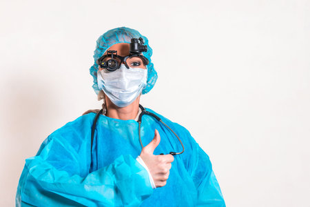 The female doctor raises a finger in approval. The concept of quality medicine.