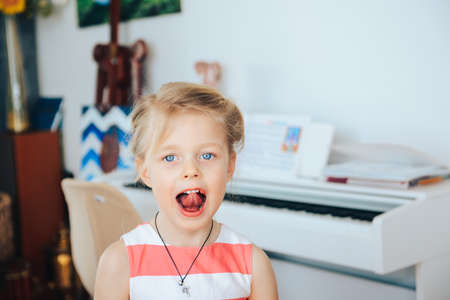 Portrait of a little girl posing with her tongue outの写真素材