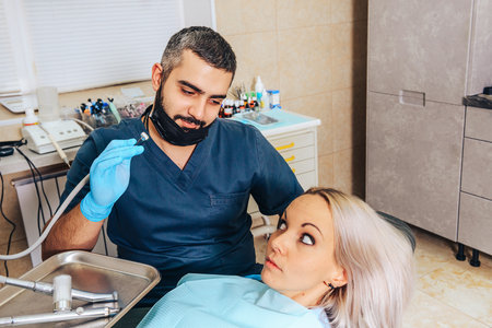 A scared blonde girl at a dentist appointment.の写真素材