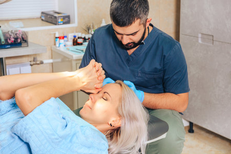 A scared blonde girl at a dentist appointment.の写真素材