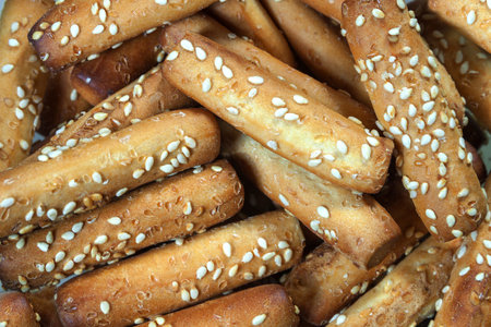Bread sticks with sesame seeds close up