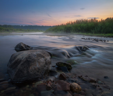 twilight on a small riverの写真素材
