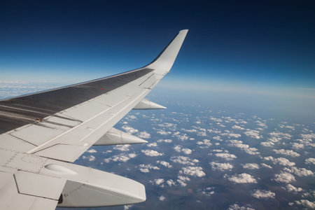 view from the airplane window to the cloudsの写真素材