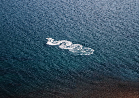 view from the air on the track at sea from a moving jet ski