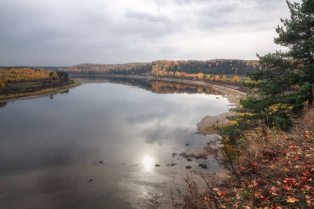 view of the river in the autumn cloudy dayの写真素材