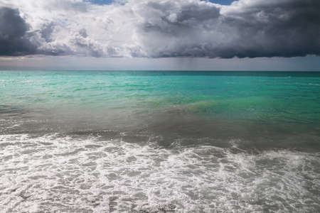 sea with blue sky and beautiful white clouds in the backgroundの写真素材