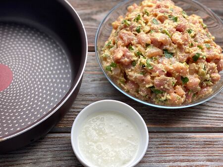 Meat cutlets are ready to fry in a pan, a recipe for cooking homemade food.の写真素材