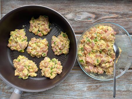 Meat cutlets are ready to fry in a pan, a recipe for cooking homemade food.の写真素材