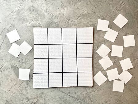 White cardboard is drawn in squares for a childrens Sudoku game.の写真素材
