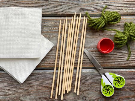 A set of creative paper napkins and scissors ready to craft.の写真素材