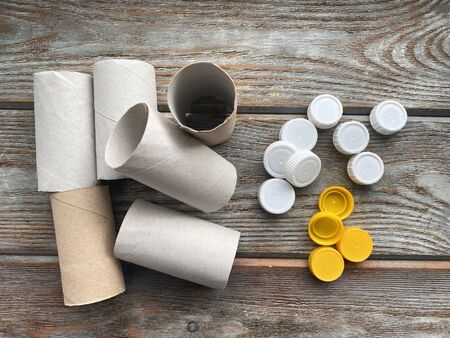 Toilet paper rolls and plastic lids, ready for childrens DIY.の写真素材