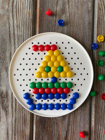 a boat made of children's mosaic, multi-colored, Small details.の写真素材