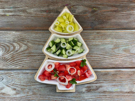 Christmas tree in the form of lettuce, cucumbers, tomatoes, peppers,.の写真素材