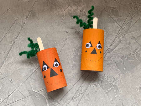 kids craft how to make a scary cute pumpkin for Halloween.の写真素材