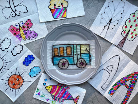 Drawing show, childrens magic experience in a plate of water, color appears.の写真素材