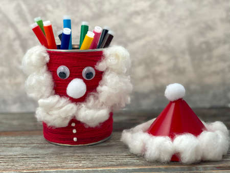 Santa Claus from simple material, recycling empty jar. Stand for pencils.の写真素材
