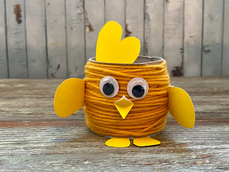 Yellow chicken Easter craft from recycling toilet paper.の写真素材