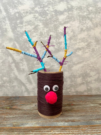 Kids craft from toilet paper recycling - new years deer with colorful horns.の写真素材