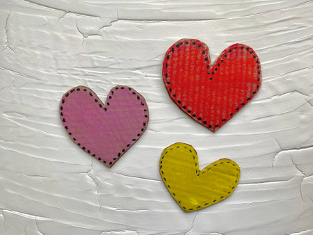 The heart is cut out of cardboard recycling, painted with bright colors.の写真素材