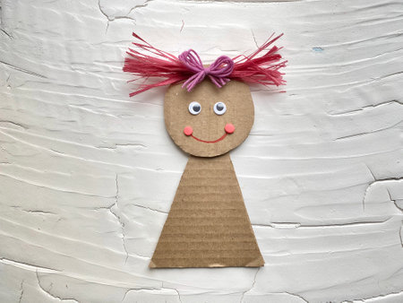 Kids craft, how to make a doll out of cardboard and plasticine.の写真素材