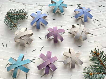 Snowflakes from a roll of toilet paper for craft.の写真素材