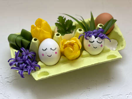 Kids craft, Easter floristry with natural materials, an empty egg box and flowers.の写真素材