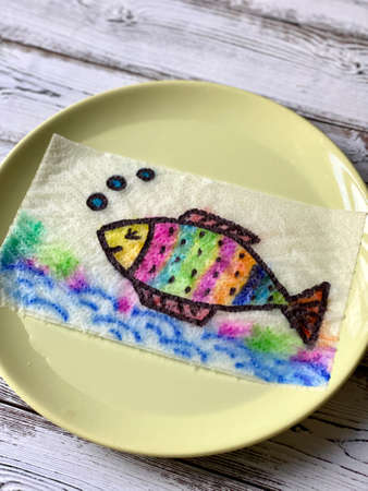 Magic, drawing fish, appears in the water, coloring book.の写真素材