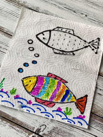 Magic, drawing fish, appears in the water, coloring book.の写真素材