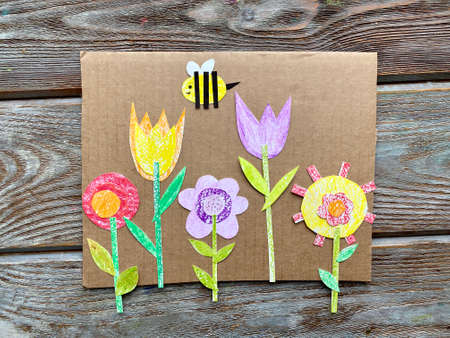 Childrens creativity, a picture made of cardboard and paper, bright flowersの写真素材
