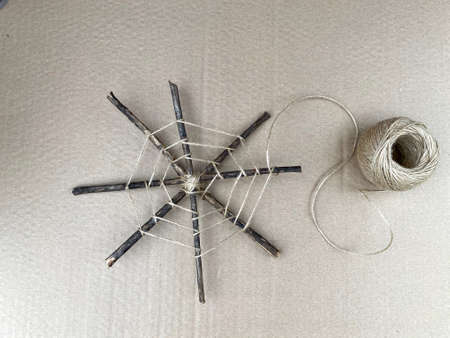 The process of children's creativity, how to make a web from sticks and rope, kids craft.の写真素材