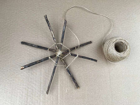 step by step how to make a web from sticks and thread, kids craft,の写真素材