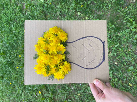 Childrens craft game on the street made of cardboard and flowers.の写真素材