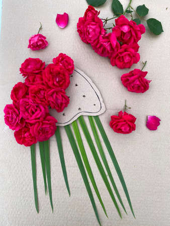 jellyfish made of cardboard and red roses, childrens creativity,の写真素材