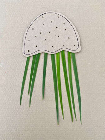 jellyfish made of cardboard processing and natural material of flowers and plantsの写真素材