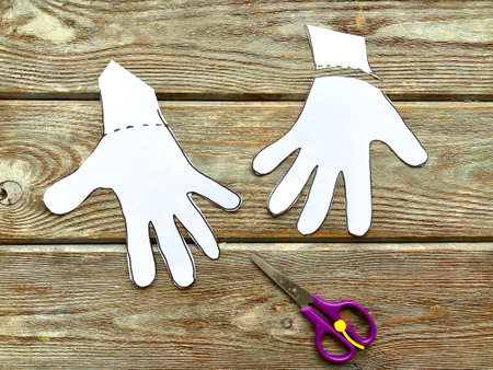 Painted palms with a marker on white paper.の写真素材