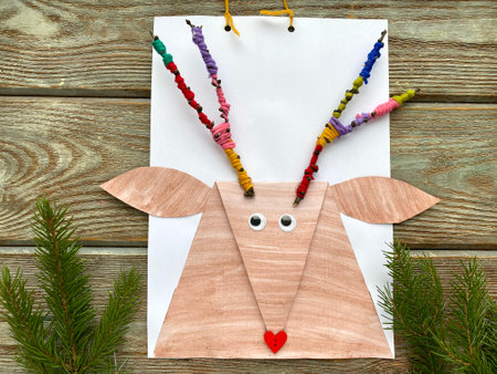 how to make a deer out of paper and twigs, childrens creativity craft.の写真素材