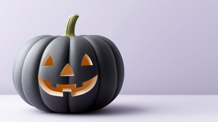 Eerie elegance defines this black jack-o'-lantern, a captivating centerpiece for Halloween celebrations, evoking a sense of mysterious joy and autumnal wonder.の写真素材
