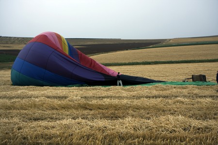 A hot air balloon lying at a fieldの写真素材