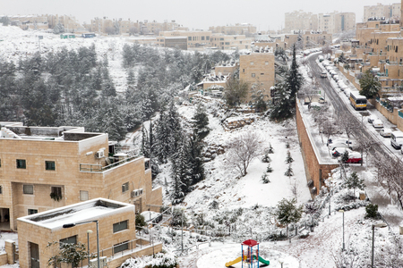 Jerusalem neighborhood and forest after a snow storm の写真素材