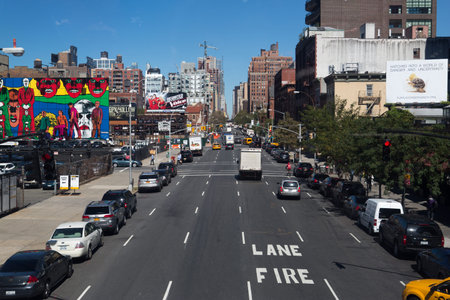 New York City multi story automated parking lots filled with cars next to the High Line