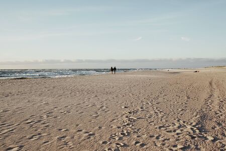 Sea. Ð¡ouple in love on a beach at sunset.  Romantic background. の写真素材